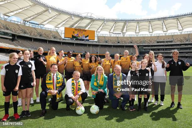 James Johnson , Roger Cook , Rita Saffioti and David Templeman pose with junior football players during a Matildas Optus Stadium Media Announcement...