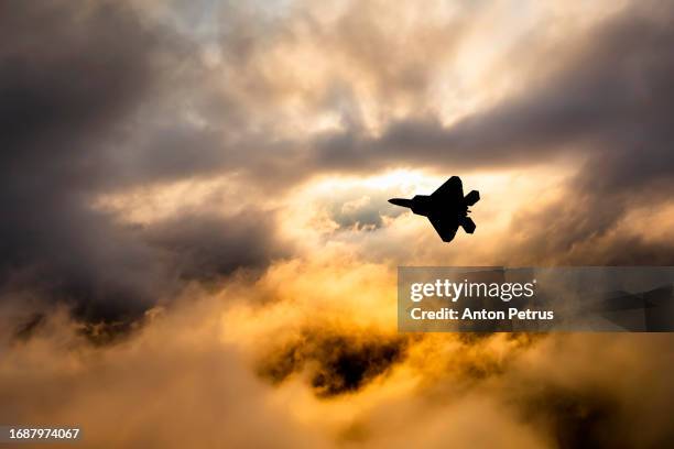 fighter aircraft at sunset. military aviation - missile defense command stock pictures, royalty-free photos & images