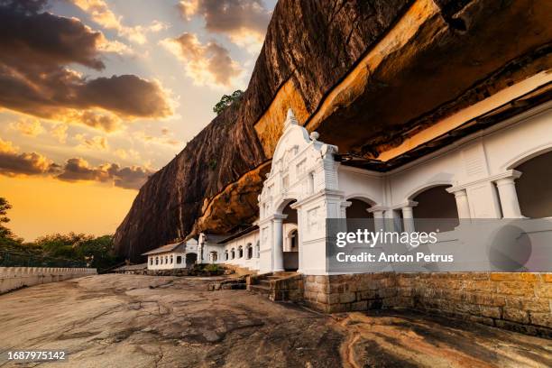 dambulla cave temple at sunset, sri lanka - buddha sri lanka stock pictures, royalty-free photos & images