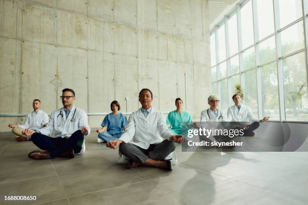 yoga meditation exercises in hospital! - nurse meditating stock pictures, royalty-free photos & images