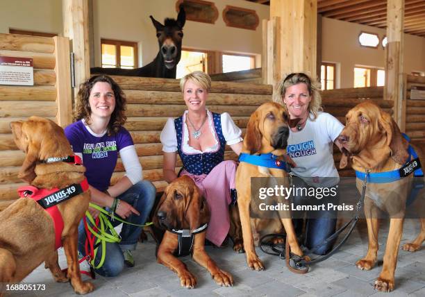 Presenter Sonja Zietlow and the dog trainers Rovenka Langkau and Alexandra Grunow pose during a Photocall for the TV show 'Sonjas Welt der Tiere!' at...