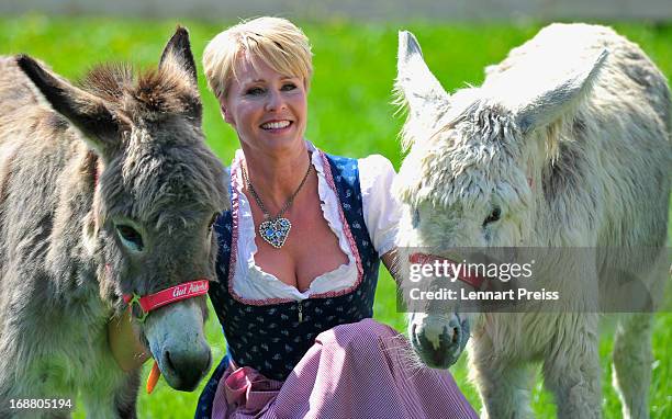 Presenter Sonja Zietlow poses during a photocall for the TV show 'Sonjas Welt der Tiere!' at Gut Aiderbichl on May 15, 2013 in Iffeldorf, Germany.