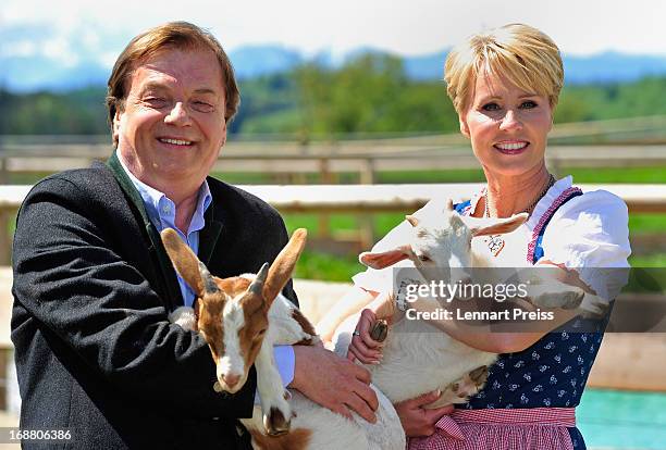 Presenter Sonja Zietlow and Michael Aufhauser pose during a photocall for the TV show 'Sonjas Welt der Tiere!' at Gut Aiderbichl on May 15, 2013 in...