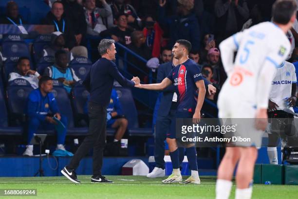 Achraf HAKIMI of PSG and Luis ENRIQUE head coach of PSG during the Ligue 1 Uber Eats match between Paris Saint-Germain Football Club and Olympique de...
