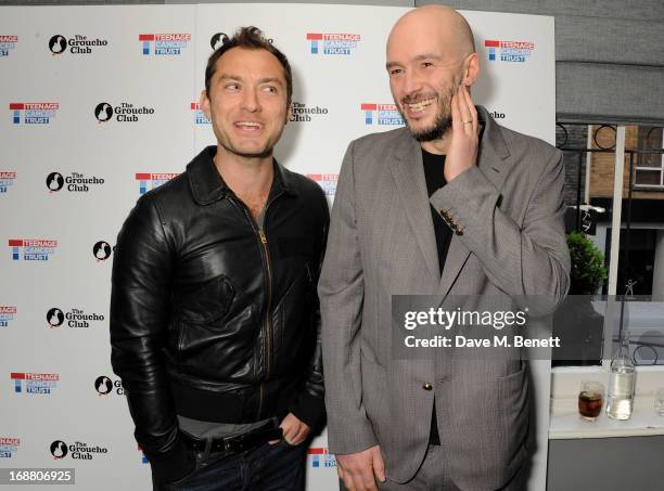 Jude Law and Jake Chapman attend the annual fundraising art auction in aid of Teenage Cancer Trust at The Groucho Club on May 15, 2013 in London,...