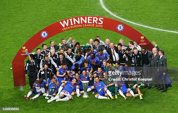 Chelsea players pose with the trophy during the UEFA Europa League Final between SL Benfica and Chelsea FC at Amsterdam Arena on May 15, 2013 in...