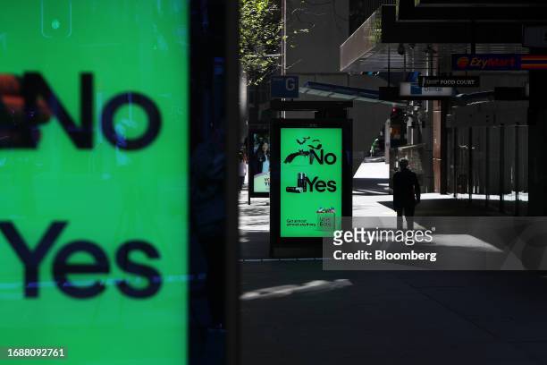 Pedestrians move past electronic signage at Martin Place in Sydney, Australia, on Sunday, Sept. 24, 2023. Celebrity endorsements and huge marches...