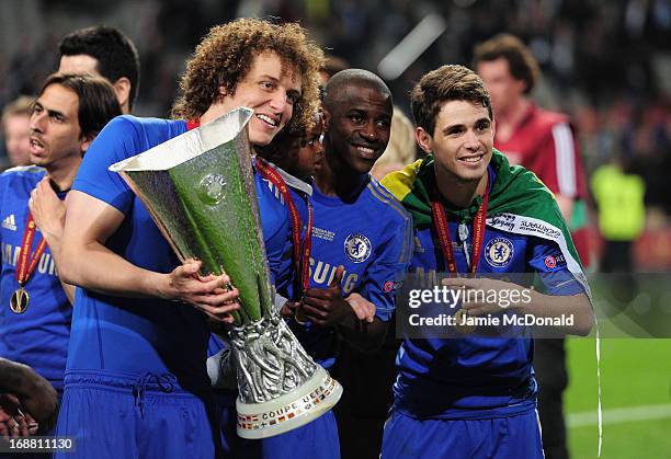 David Luiz, Ramires and Oscar of Chelsea pose with trophy during the UEFA Europa League Final between SL Benfica and Chelsea FC at Amsterdam Arena on...