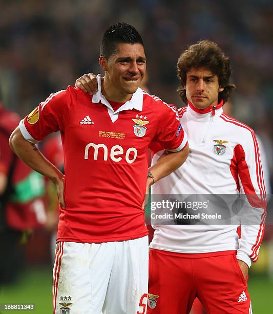 Dejected Enzo Perez of Benfica is consoled by Pablo Aimar of Benfica during the UEFA Europa League Final between SL Benfica and Chelsea FC at...