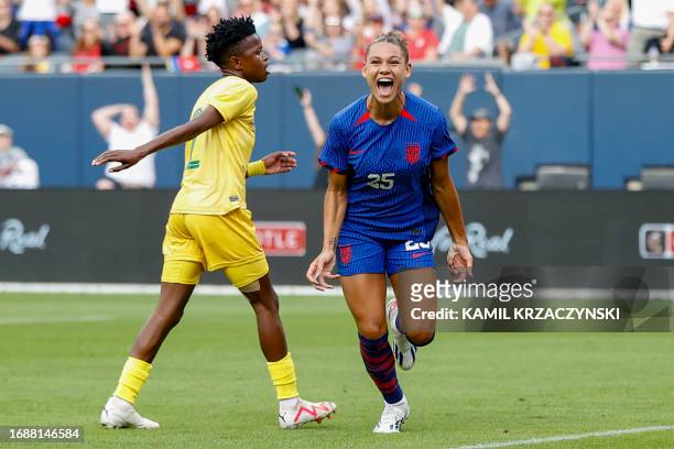 S forward Trinity Rodman celebrates scoring her team's first goal during the women's international friendly football match between the USA and South...