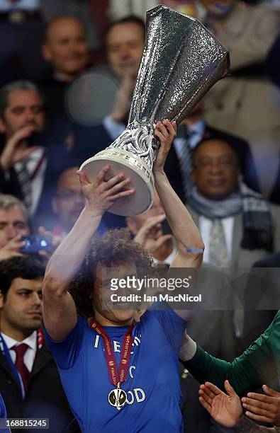 David Luis of Chelsea lifts the trophy during the Europa League Final match between Chelsea and SL Benfica at The Amsterdam Arena on May 15, 2013 in...