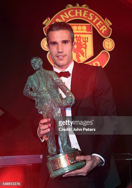Robin van Persie of Manchester United poses with the Sir Matt Busby Fans' Player of the Year at the club's annual Player of the Year awards ceremony...