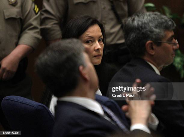 Kelly Soo Park glances at her lawyer George Buehler , as they and her other lawyer Mark Kassabian listen to opening statements on May 15, 2013 in Los...