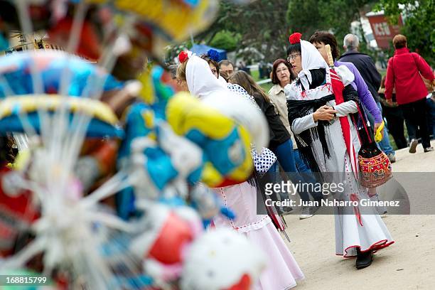Women dressed in chulapo, traditional clothing of the San Isidro, look on during the festivities on May 15, 2013 in Madrid, Spain.