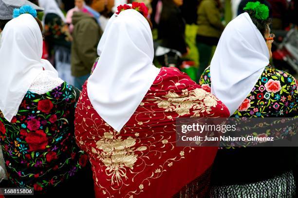 Women dressed in chulapo, traditional clothing of the San Isidro, look on during the festivities on May 15, 2013 in Madrid, Spain.