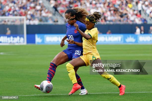 S defender Casey Krueger fights for the ball with South Africa's midfielder Noxolo Cesane during the women's international friendly football match...