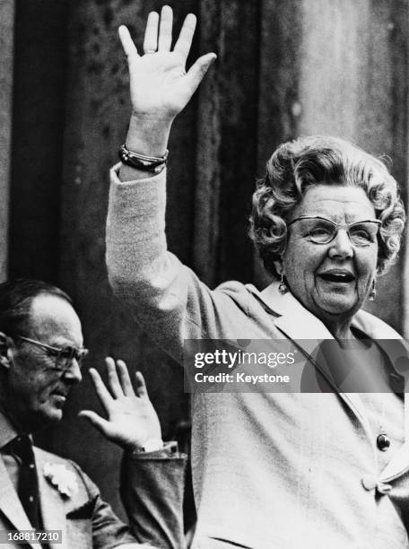 Queen Juliana of the Netherlands waving with Prince Bernhard of the Netherlands during the celebrations at Soestdijk Palace for her 64th birthday on...