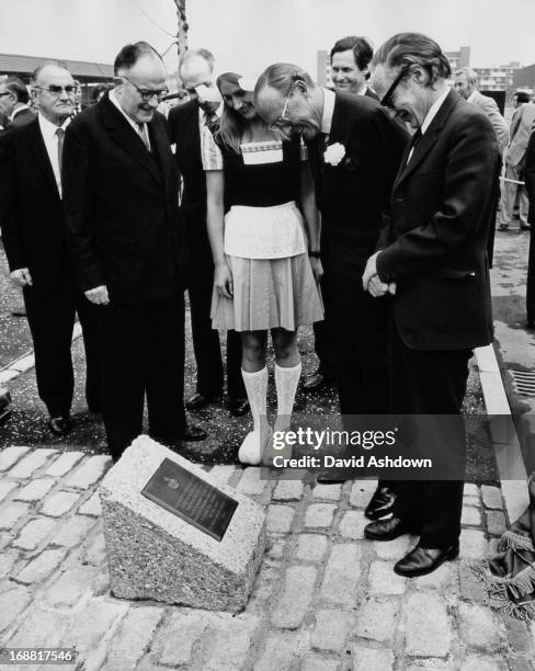 Prince Bernhard of the Netherlands looks at a plaque he has unveiled at the site of nine elm trees which were earlier presented to the new fruit and...