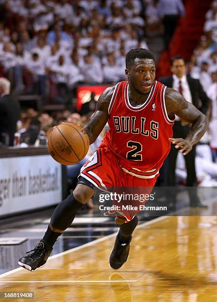 Nate Robinson of the Chicago Bulls dribbles during Game Five of the Eastern Conference Semifinals of the 2013 NBA Playoffs against the Miami Heat at...