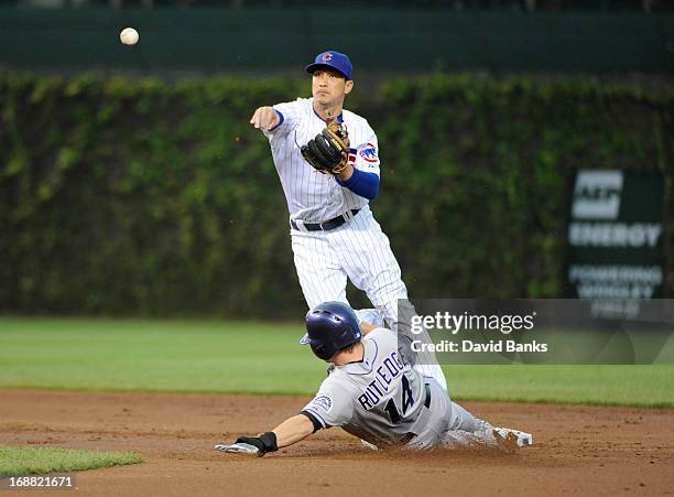 Darwin Barney of the Chicago Cubs forces out Josh Rutledge of the Colorado Rockies during the second inning on May 15, 2013 at Wrigley Field in...