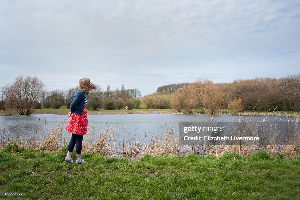 A young woman by the lake