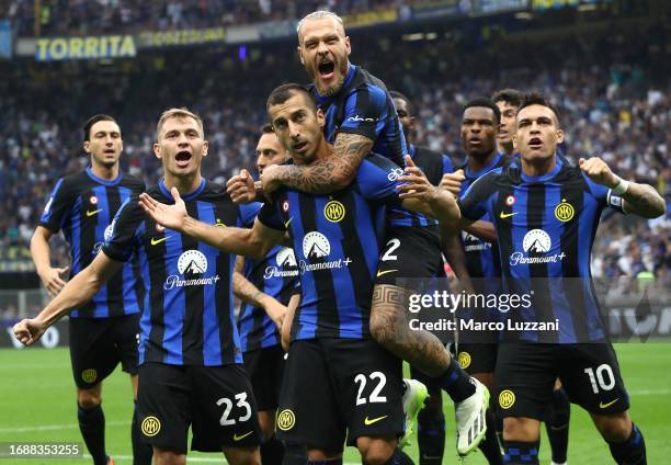 Henrikh Mkhitaryan of FC Internazionale celebrates with his team-mates after scoring the opening goal during the Serie A TIM match between FC...