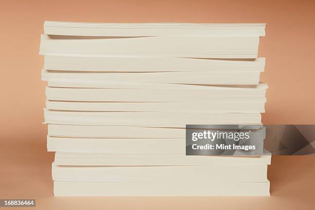 a stack of recycled white paper, paper supplies. - ream of paper stock pictures, royalty-free photos & images