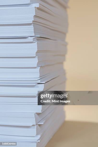 a stack of recycled white paper, paper supplies. - ream of paper stock pictures, royalty-free photos & images