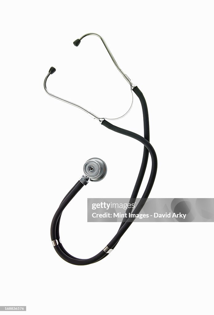 A doctor's stethoscope, a diagnostic instrument for assessment of health. Black tubing. Ear pieces, and chest piece.