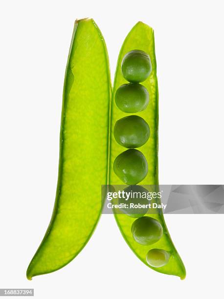 close up of peas in pea pod - peas stock pictures, royalty-free photos & images