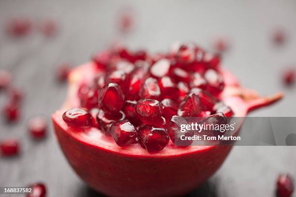 pomegranate and seeds - pomegranate stock pictures, royalty-free photos & images