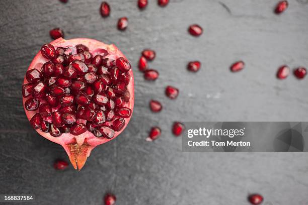 pomegranate and seeds - pomegranate stock pictures, royalty-free photos & images