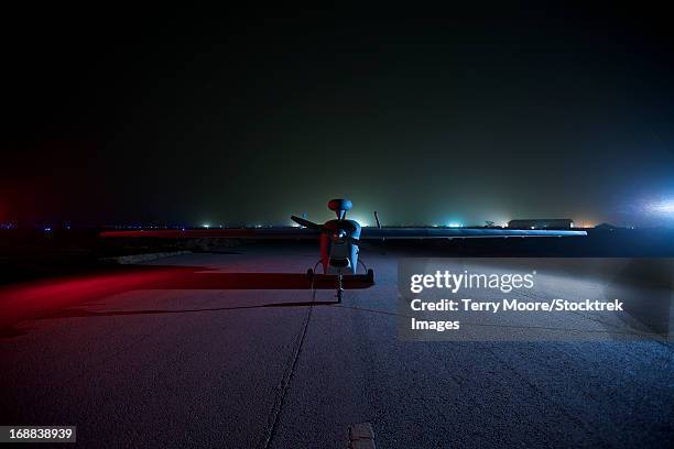 an rq-5 hunter unmanned aerial vehicle on the tarmac at cob speicher, tikrit, iraq, during operation iraqi freedom. - military base drone stock pictures, royalty-free photos & images