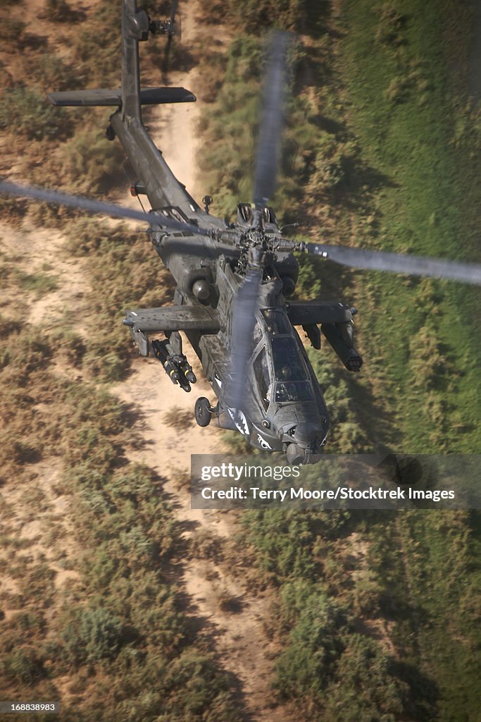 An AH-64D Apache Longbow helicopter in flight over Northern Iraq.