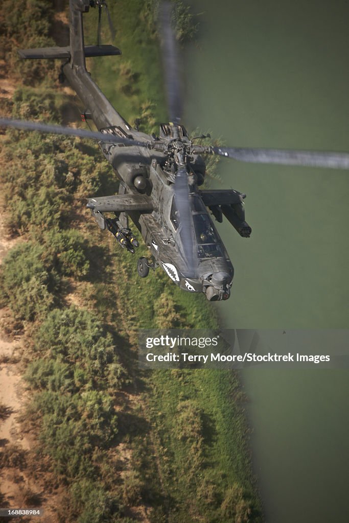 An AH-64D Apache Longbow helicopter in flight over Northern Iraq.