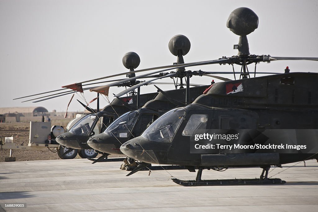 OH-58D Kiowa helicopters on the flight line at COB Speicher, Tikrit, Iraq, during Operation Iraqi Freedom.