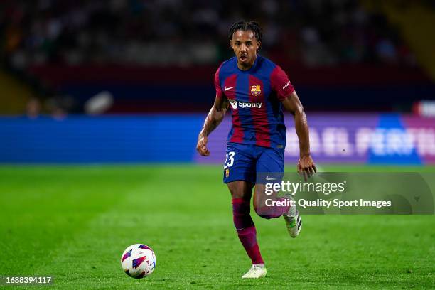 Jules Kounde of FC Barcelona with the ball during the LaLiga EA Sports match between FC Barcelona and Real Betis at Estadi Olimpic Lluis Companys on...