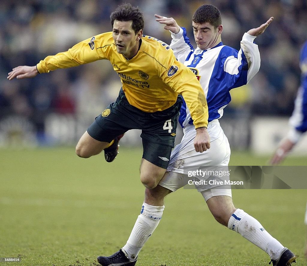 Jackie McNamara of Celtic is brought down by Alistair Mitchell of Kilmarnock