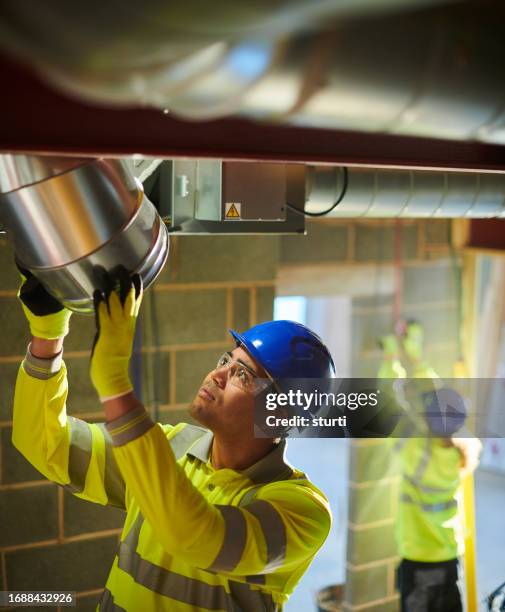 air conditioning installation - electrical equipment stock pictures, royalty-free photos & images