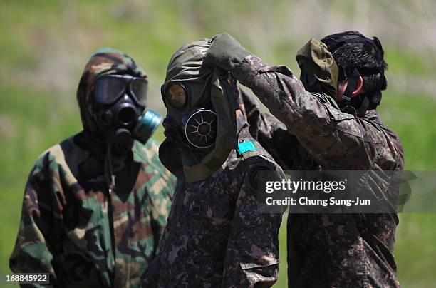 Soldiers from the 4th Chemical Company, 23rd Chemical Battalion, 1st Armored Brigade Combat Team of 2nd Infantry Division participate in...