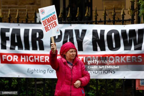 Lecturers and other staff picket outside Glasgow University as strike action begins at five Scottish universities on September 18, 2023 in Glasgow,...