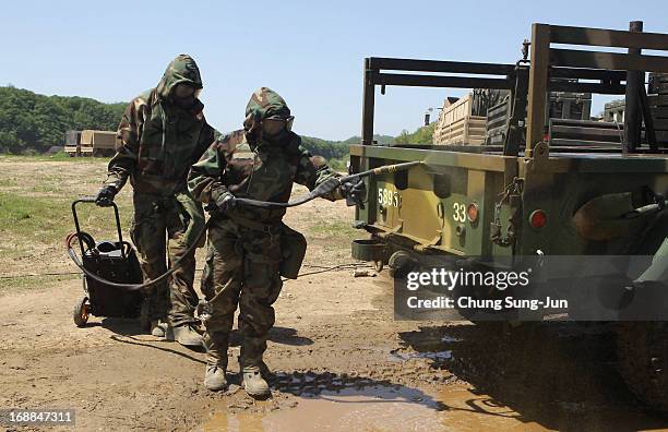 Soldiers from the 4th Chemical Company, 23rd Chemical Battalion, 1st Armored Brigade Combat Team of 2nd Infantry Division participate in...