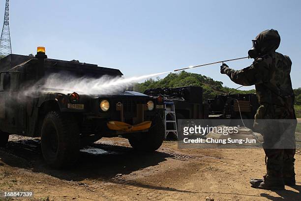 Soldiers from the 4th Chemical Company, 23rd Chemical Battalion, 1st Armored Brigade Combat Team of 2nd Infantry Division participate in...