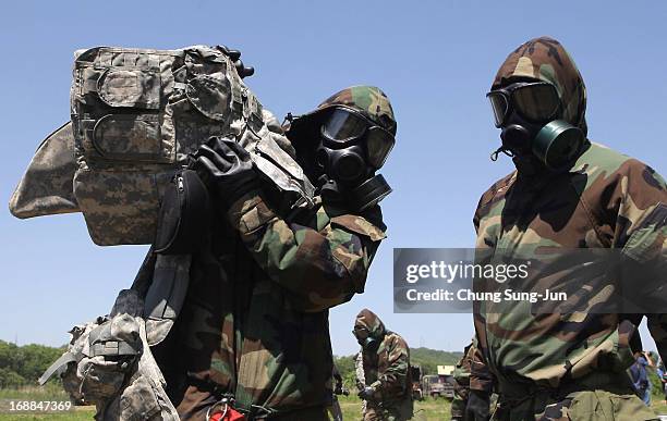 Soldiers from the 4th Chemical Company, 23rd Chemical Battalion, 1st Armored Brigade Combat Team of 2nd Infantry Division participate in...