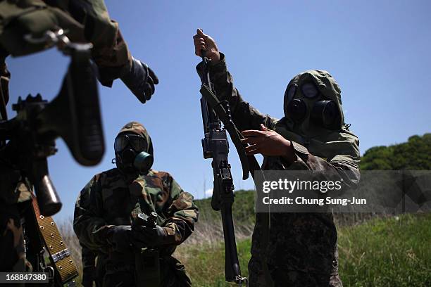 Soldiers from the 4th Chemical Company, 23rd Chemical Battalion, 1st Armored Brigade Combat Team of 2nd Infantry Division participate in...