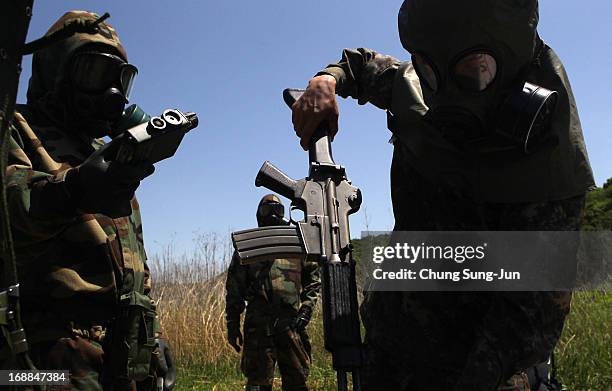 Soldiers from the 4th Chemical Company, 23rd Chemical Battalion, 1st Armored Brigade Combat Team of 2nd Infantry Division participate in...