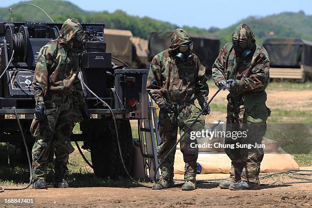 Soldiers from the 4th Chemical Company, 23rd Chemical Battalion, 1st Armored Brigade Combat Team of 2nd Infantry Division participate in...