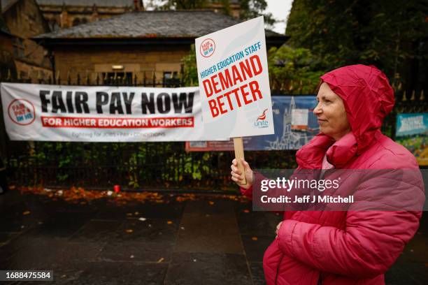Lecturers and other staff picket outside Glasgow University as strike action begins at five Scottish universities on September 18, 2023 in Glasgow,...