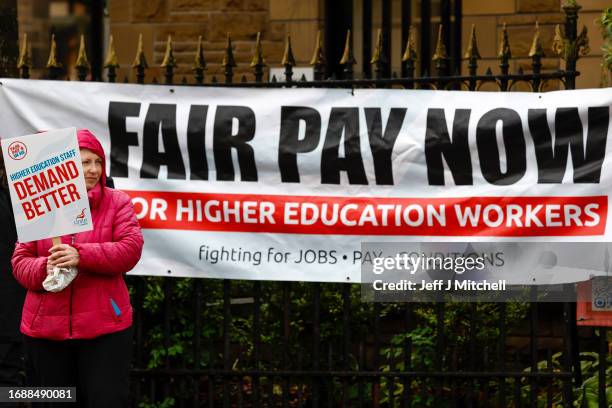 Lecturers and other staff picket outside Glasgow University as strike action begins at five Scottish universities on September 18, 2023 in Glasgow,...