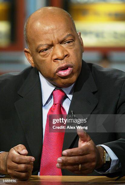 Representative John Lewis gestures as he discusses the political future of U.S. Senate Republican Leader Trent Lott on NBC's 'Meet the Press' during...